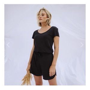 Albion Serenity Romper in black. Brand New Size M